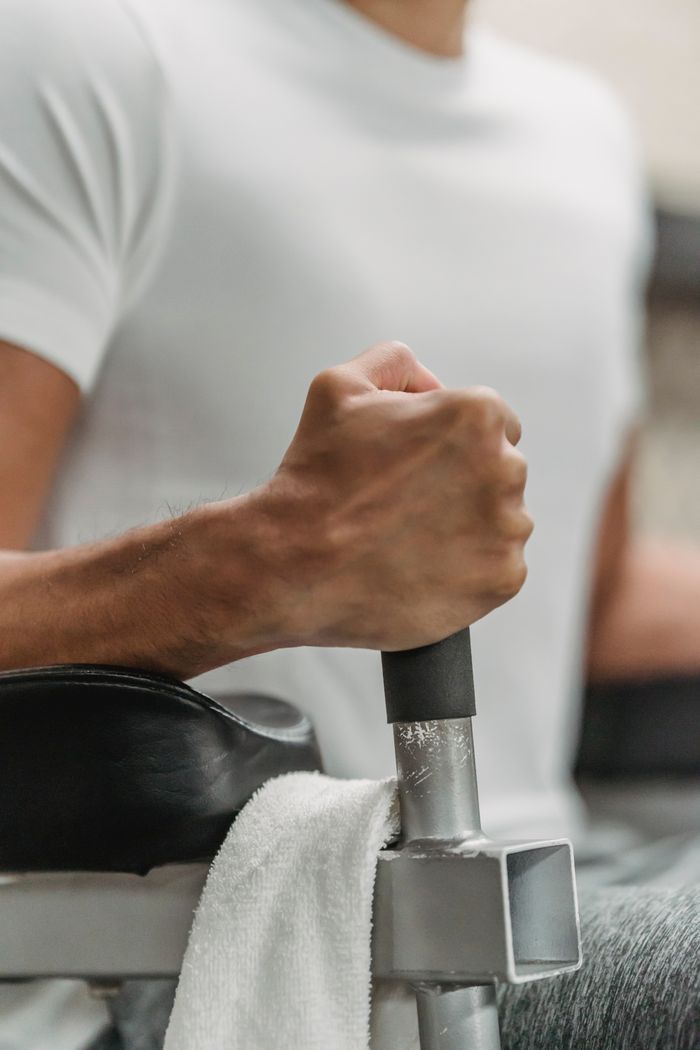 The Art of Drawing Readers In: Your attractive post title goes here Crop unrecognizable muscular ethnic sportsman in white t shirt training in gym in daylight